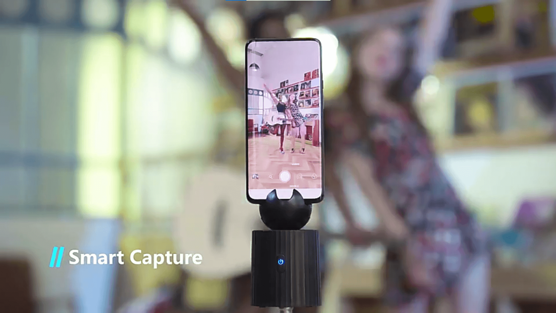 A black auto object tracking phone holder sold by WorkZen Interiors