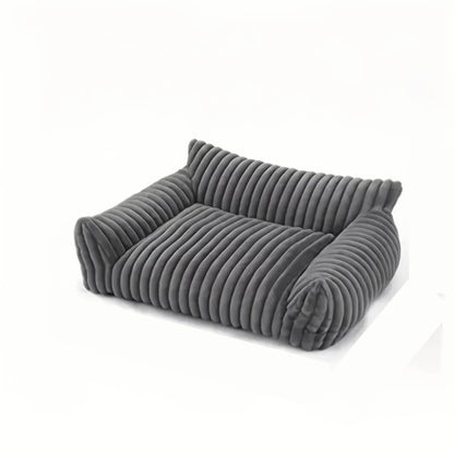 Folded gray ribbed blanket on a white background