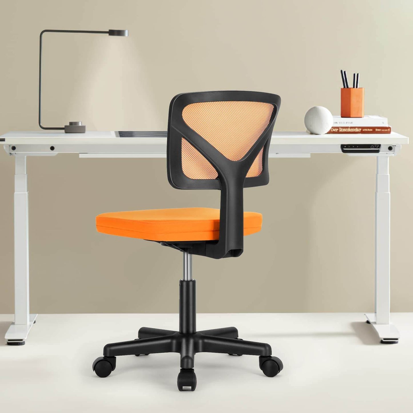 An orange Ergo Mesh Office Chair sold by WorkZen Interiors