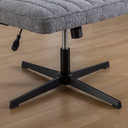 The height adjustment levers of a Gray fabric office chair sold by WorkZen Interiors
