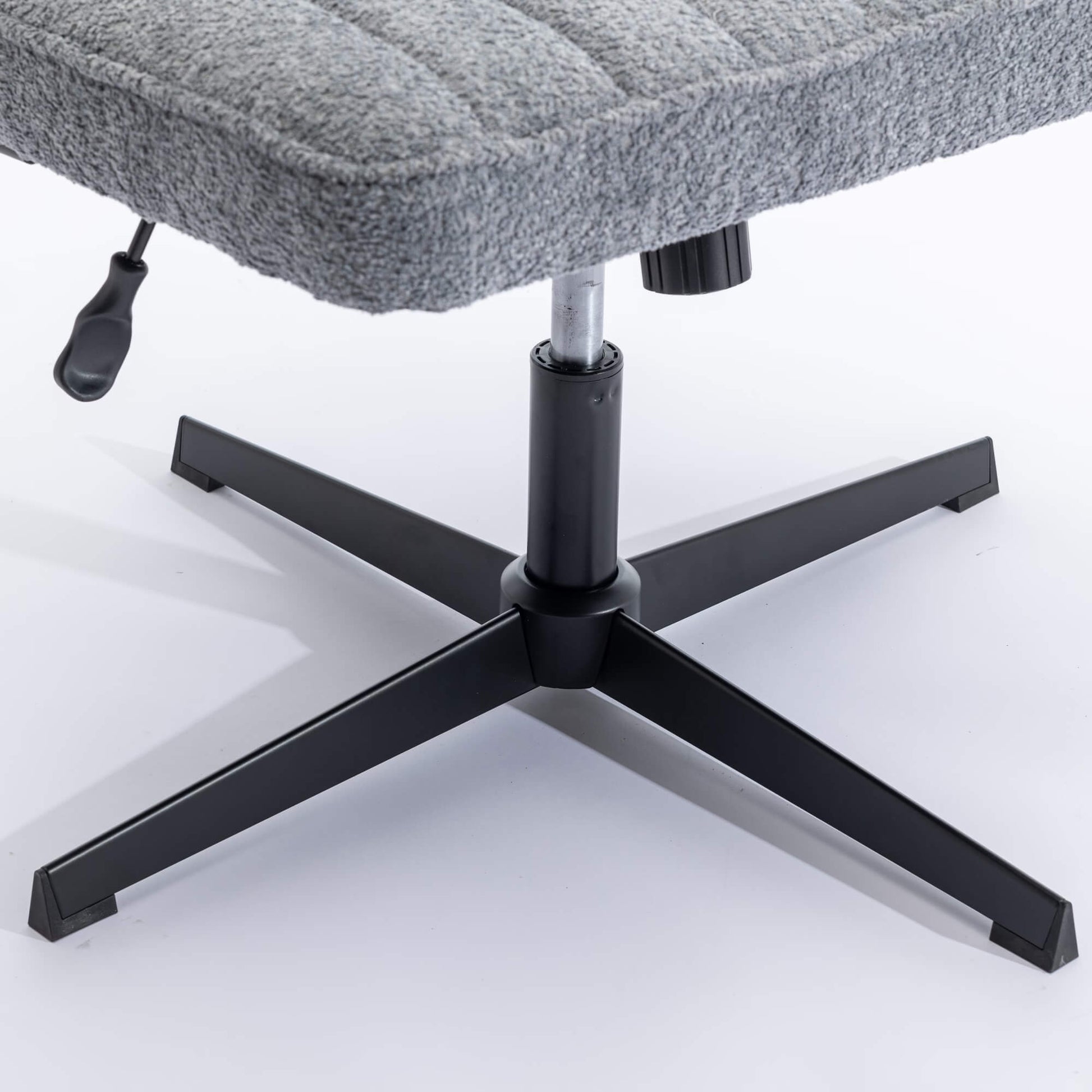 The height adjustment levers of a Gray fabric office chair sold by WorkZen Interiors