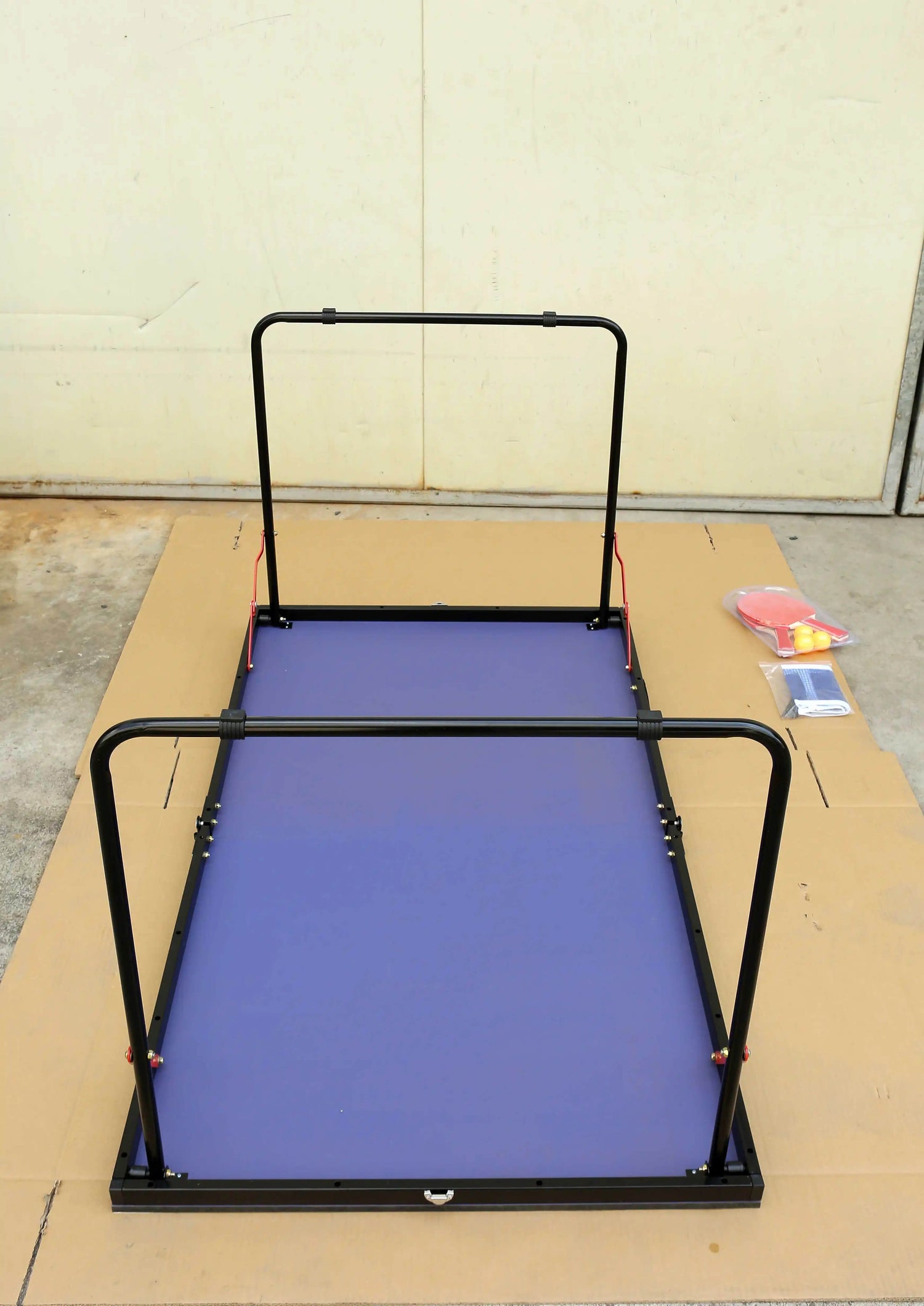 A blue foldable table tennis table sold by WorkZen Interiors