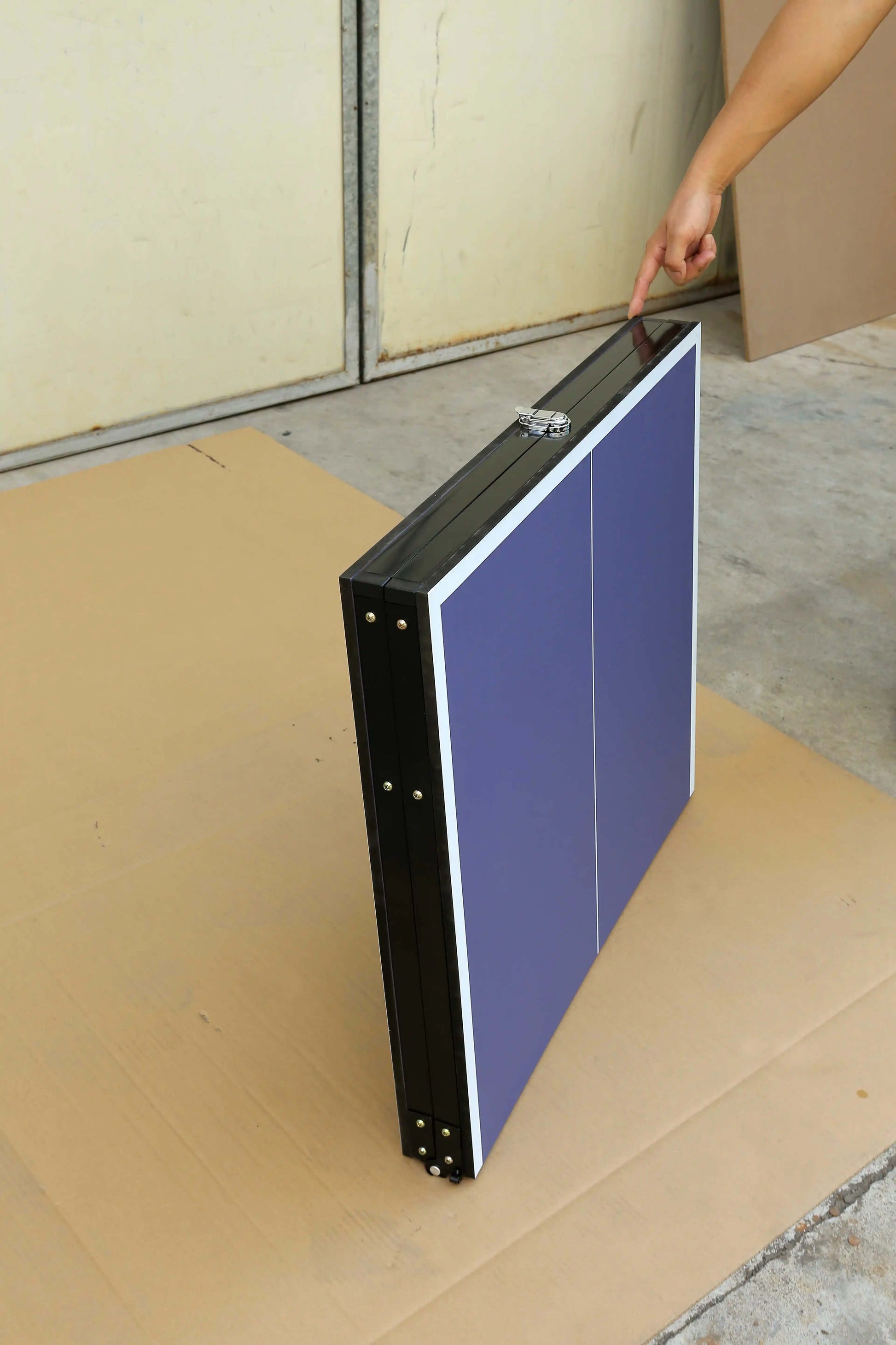 A blue foldable table tennis table sold by WorkZen Interiors