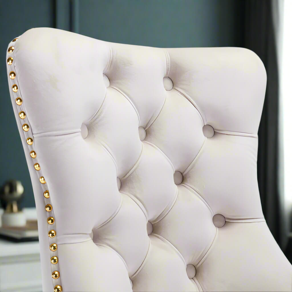 The backrest of a white velvet office chair sold by WorkZen Interiors 