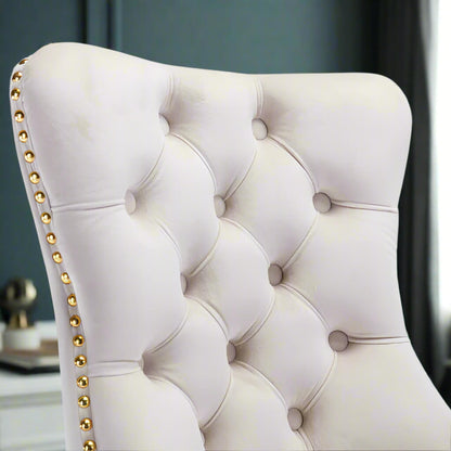 The backrest of a white velvet office chair sold by WorkZen Interiors 
