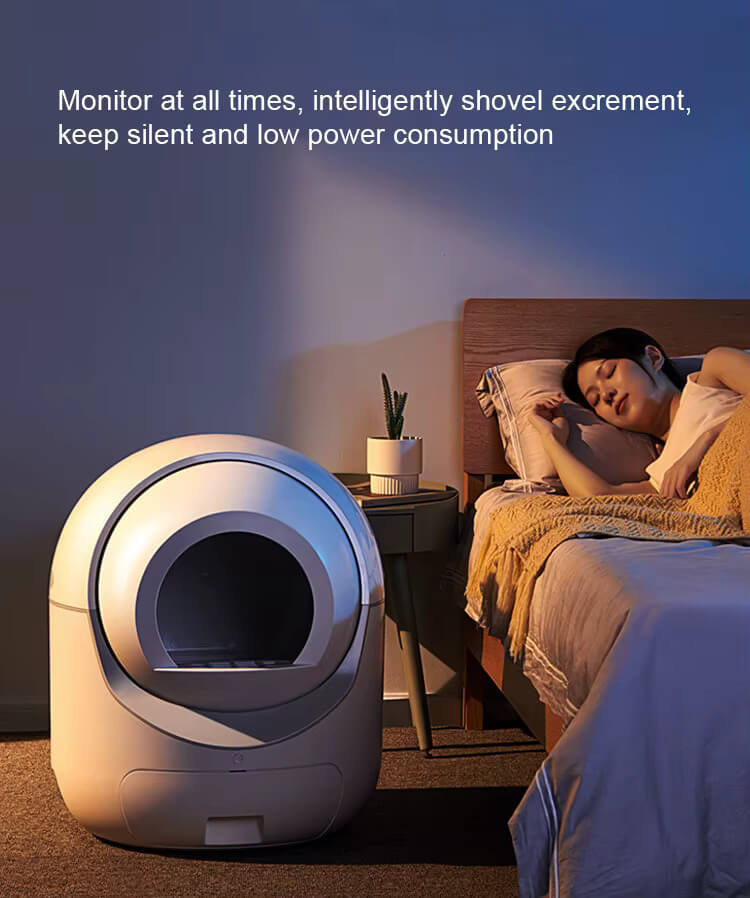 Smart litter box in a bedroom with a person sleeping on the bed, text about monitoring and low power consumption.