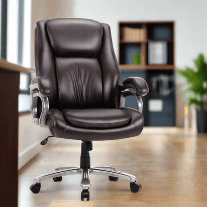 A brown high back office chair sold by WorkZen Interiors in an office with a table in front of it, a book shelf behind it and a green plant in the background.