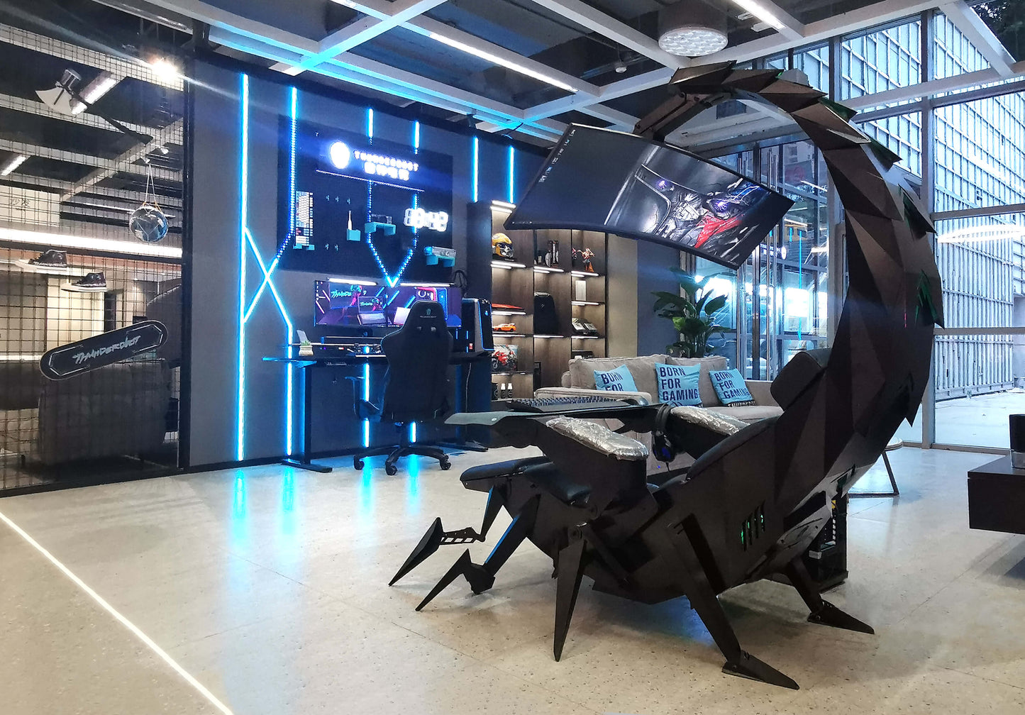 Modern office space with a scorpion gaming chair and gaming setup.