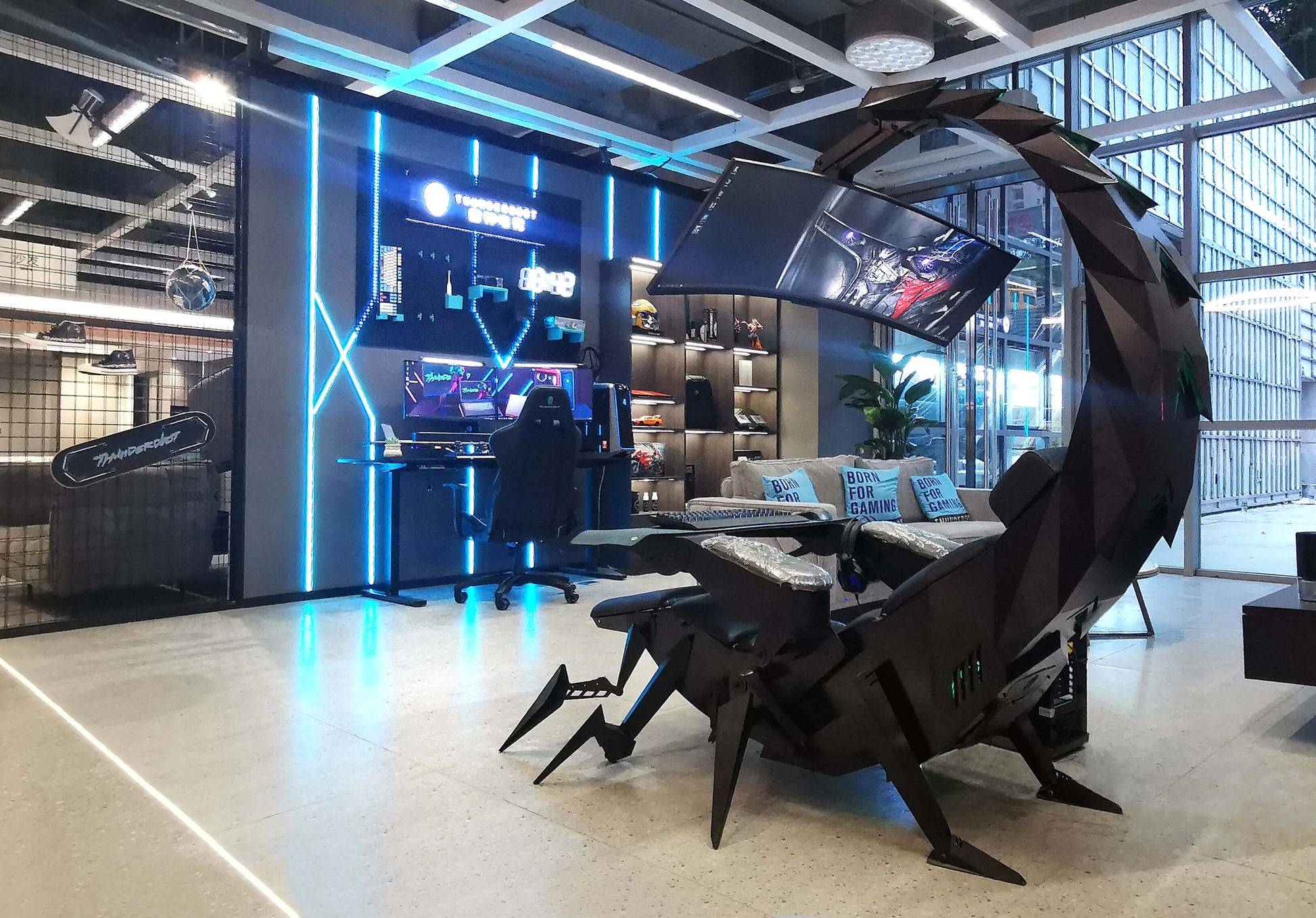 Modern office space with a scorpion gaming chair and gaming setup.