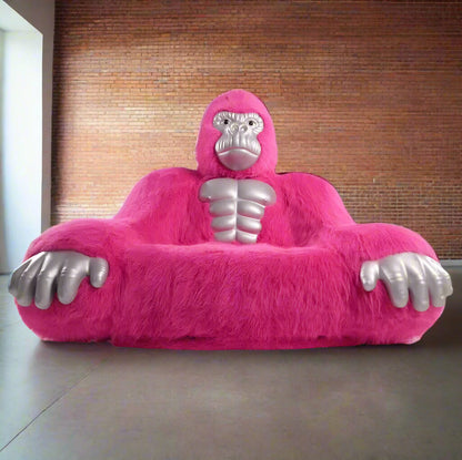 A pink inflatable gorilla sofa sold by WorkZen Interiors