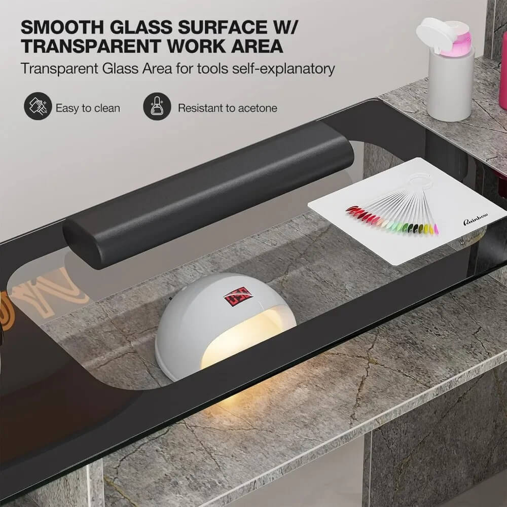 The smooth glass surface of a grey marble L shaped manicure table sold by WorkZen Interiors