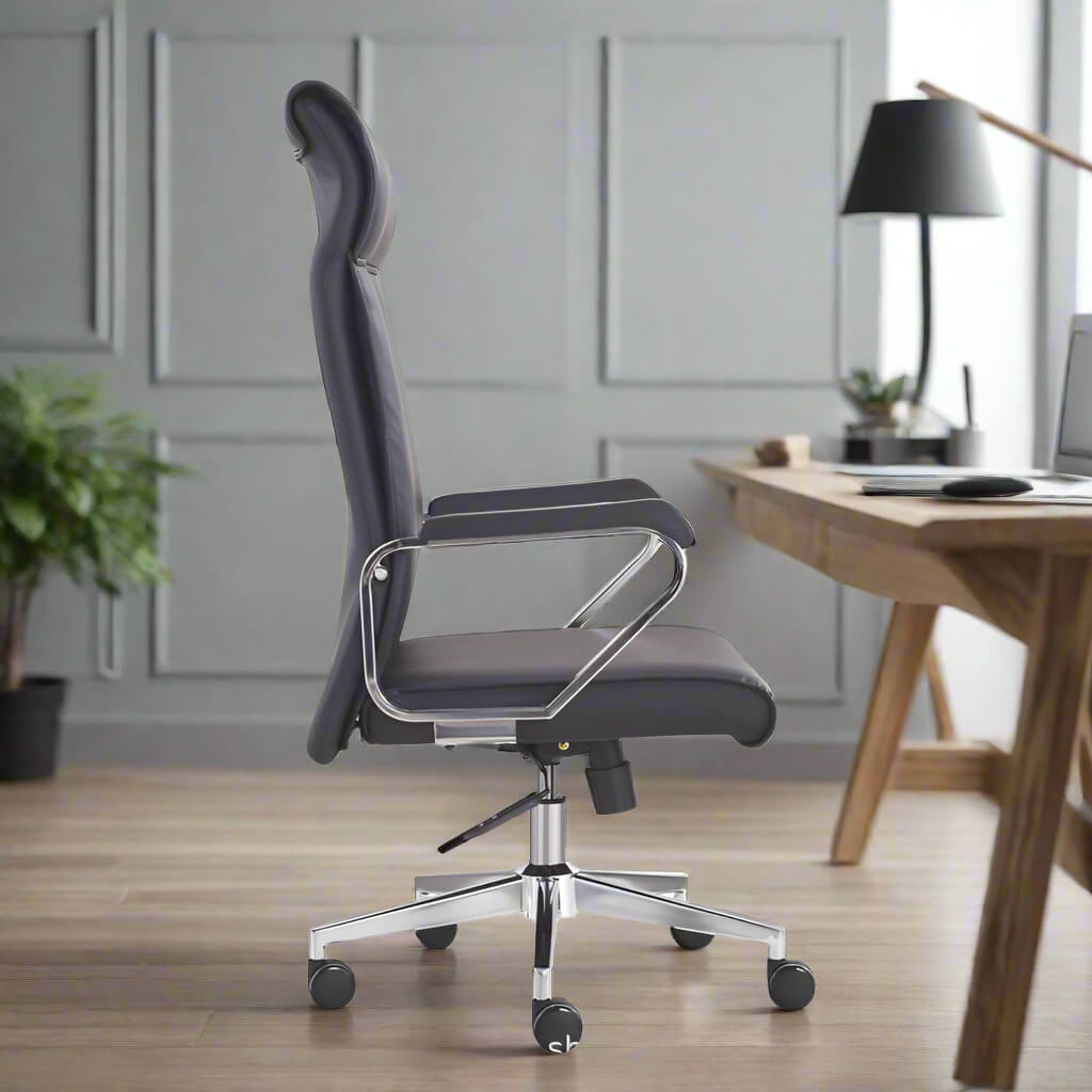 The side view of a black leather office chair in a home office