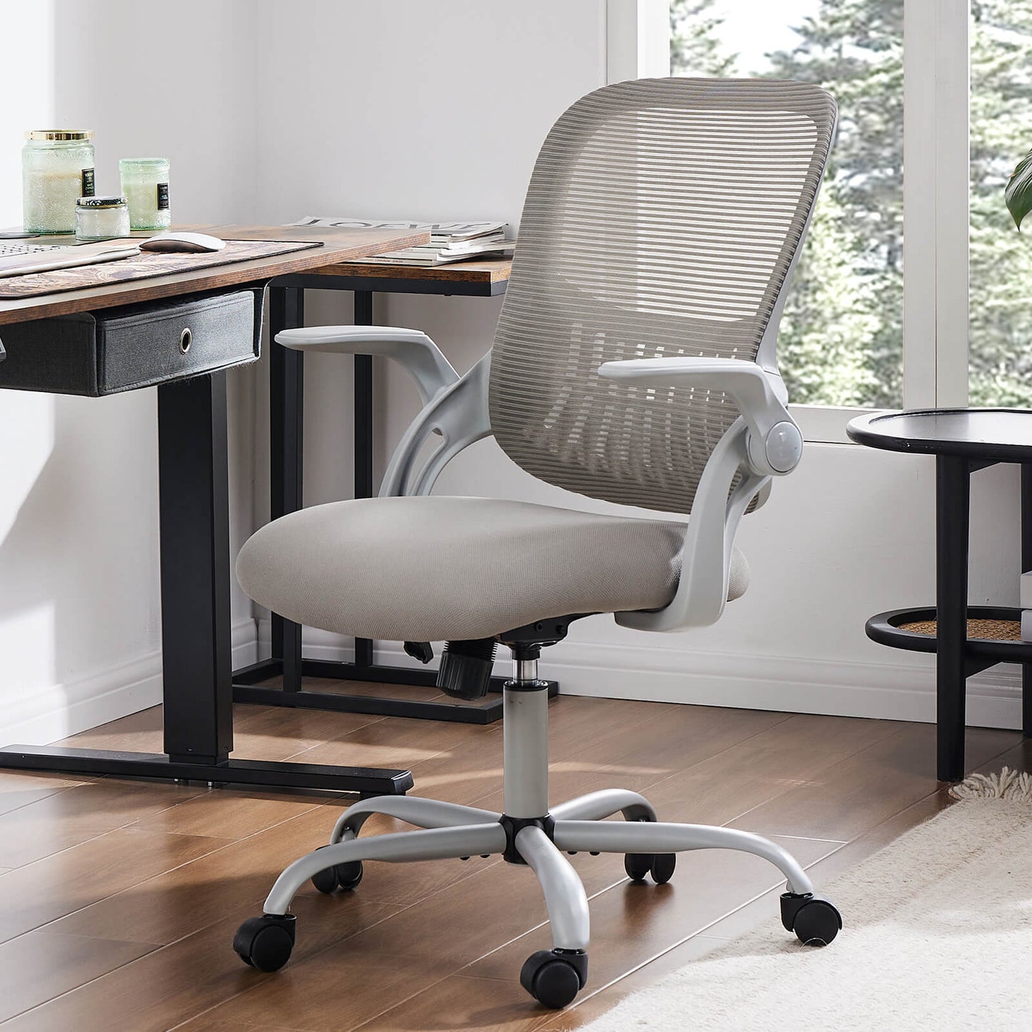 A gray mesh back office desk chair sold by WorkZen Interiors
