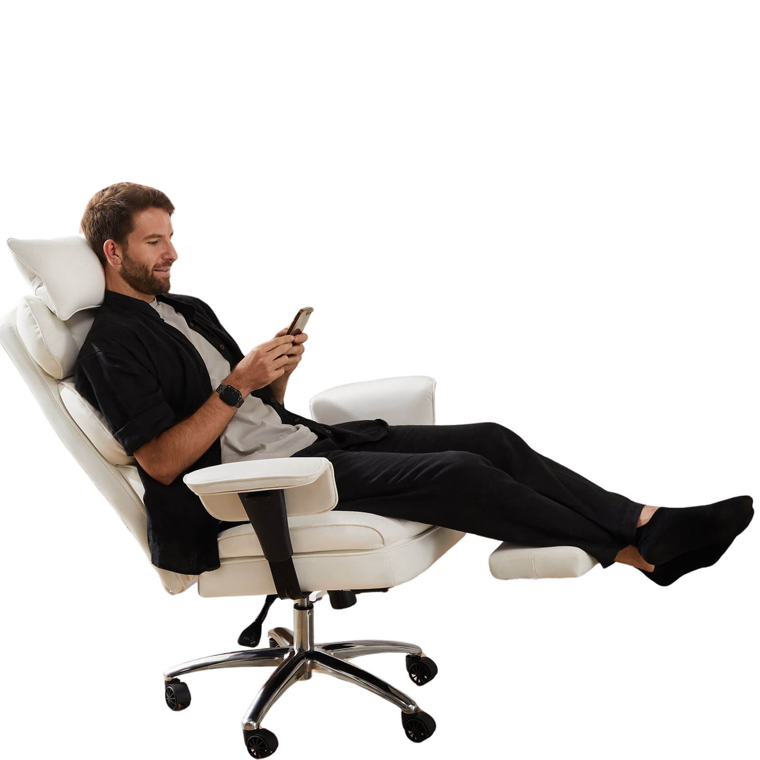 A man on his phone and enjoying the reclining function of a white executive office chair 