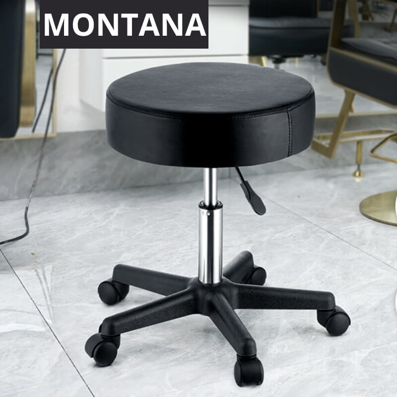 A black leather stool in a barber's shop sold by WorkZen Interiors