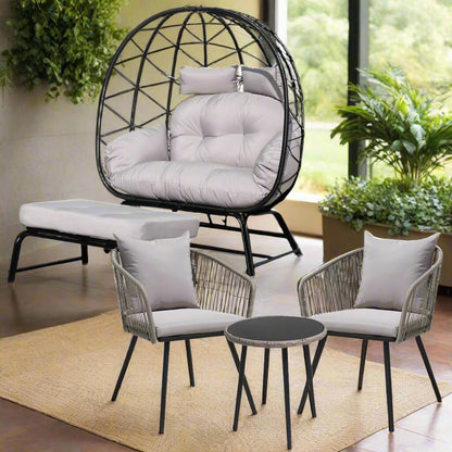 Outdoor furniture set with egg-shaped chair, two chairs, and a small table on a patio.