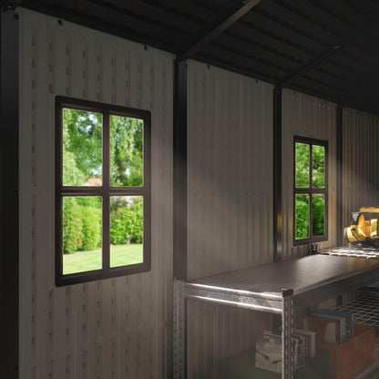 Modern interior of a resin outdoor storage shed with windows showing greenery outside.