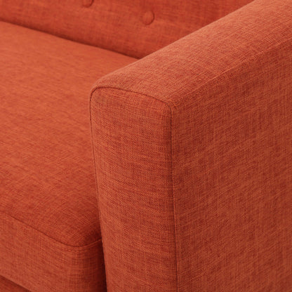 The armrest of an orange lounger sofa sold by WorkZen Interiors