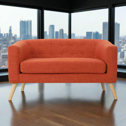 The front of an orange lounger sofa sold by WorkZen Interiors