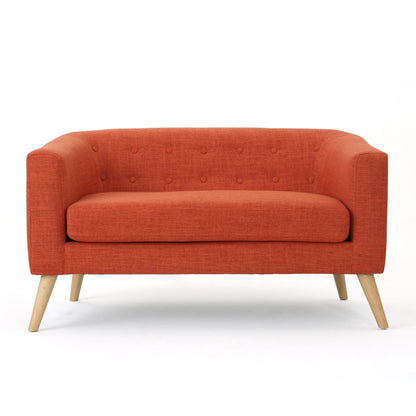 The front of an orange lounger sofa sold by WorkZen Interiors