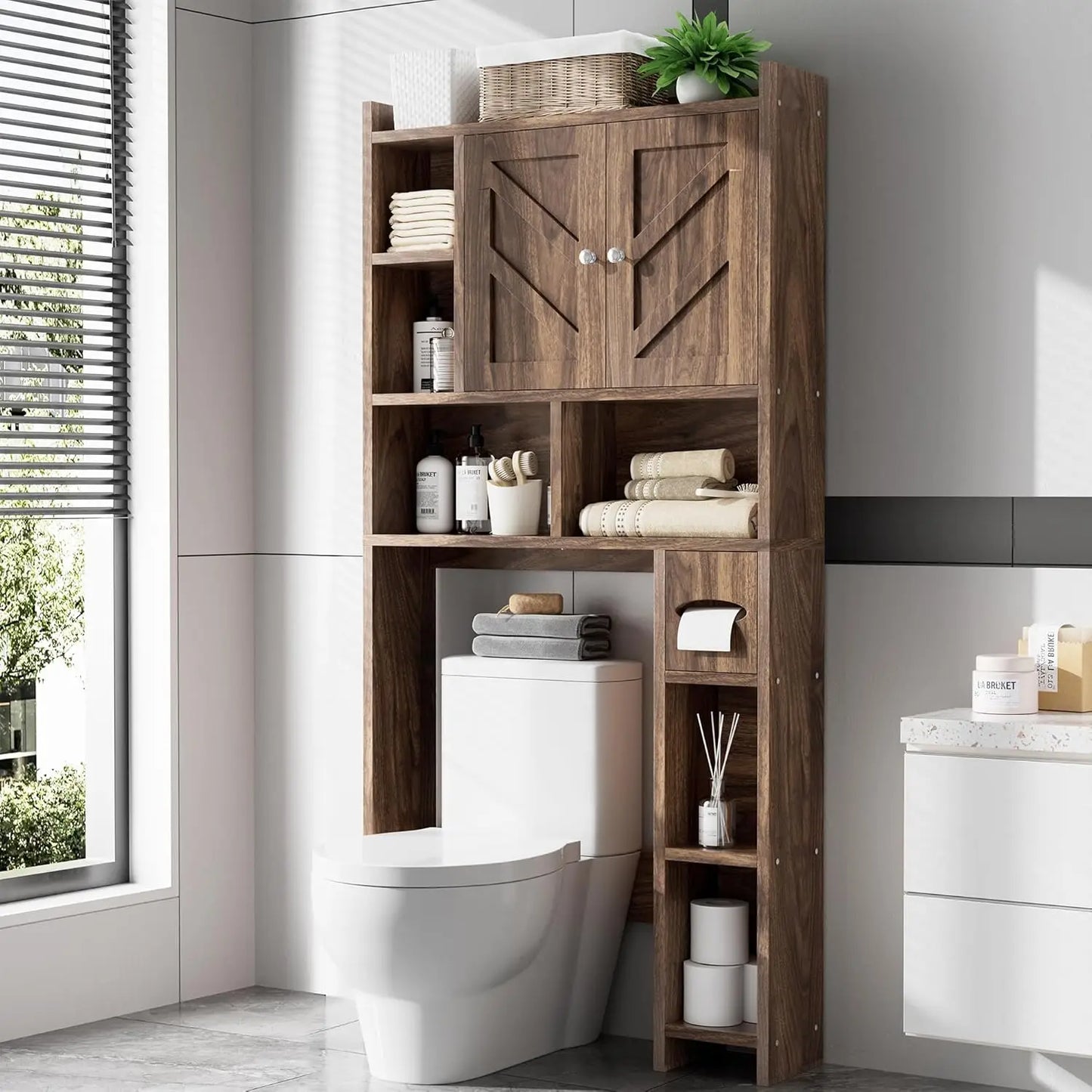 Bathroom with wooden storage cabinet next to a toilet