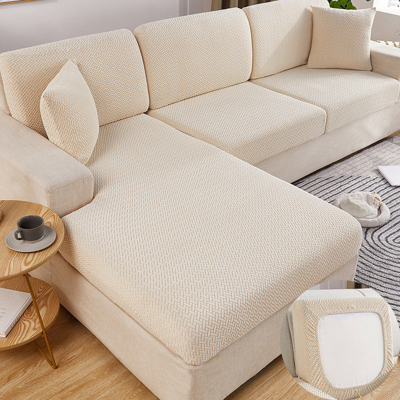 A beige Sectional Sofa Slipcovers sold by WorkZen Interiors