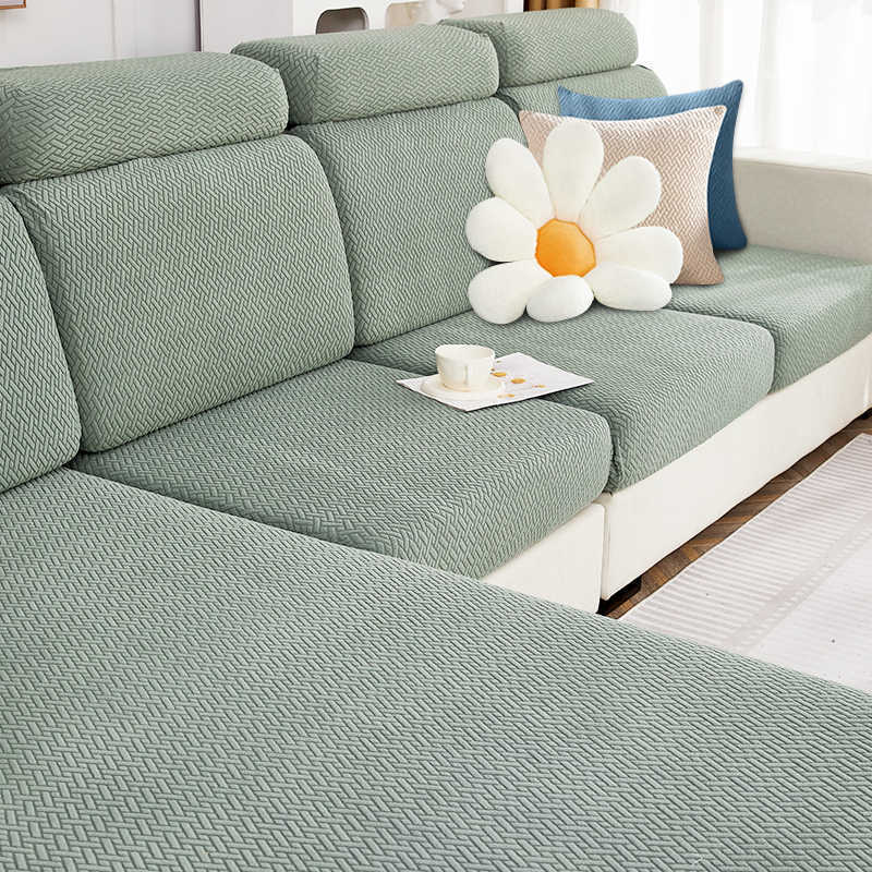 A green Sectional Sofa Slipcovers sold by WorkZen Interiors