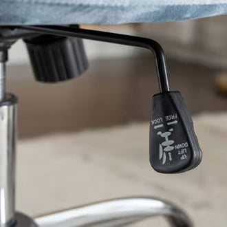 A velvet office chair adjustment lever