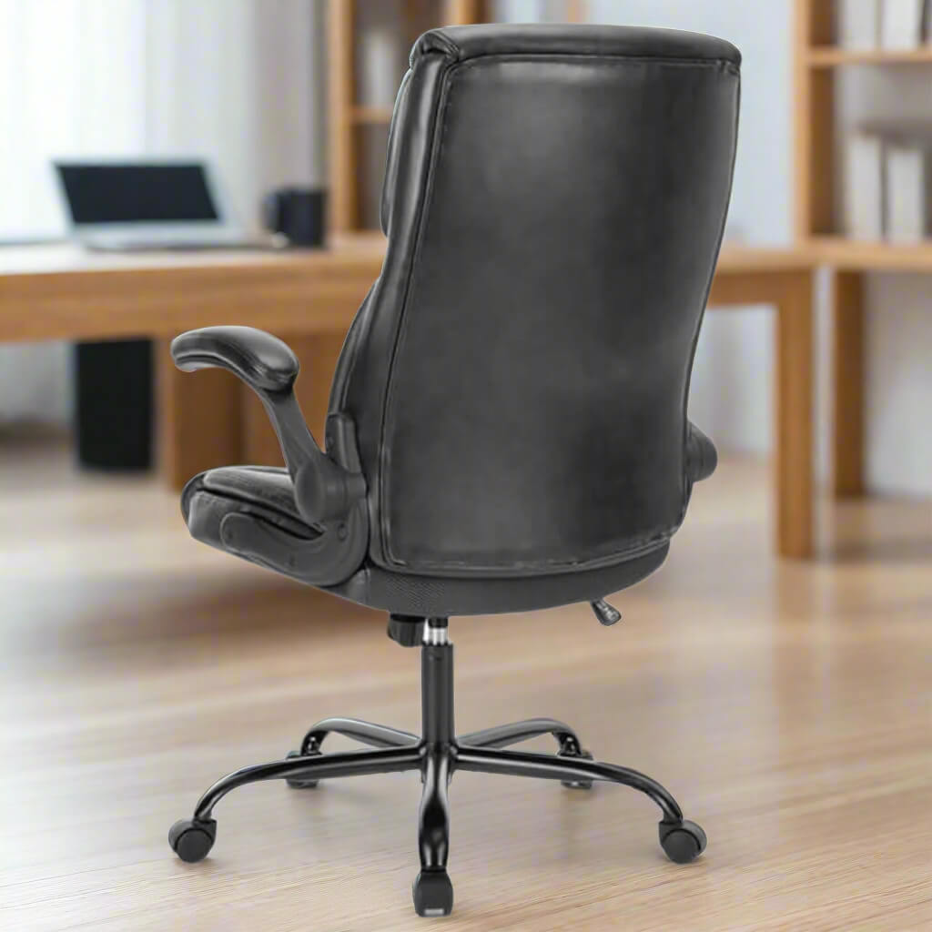 The back of a black leather office chair sold by WorkZen Interiors