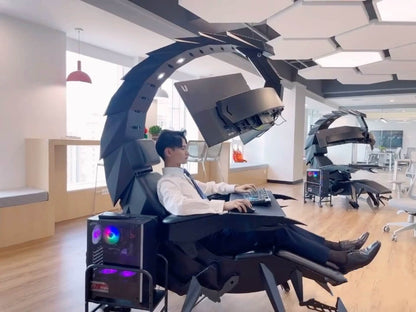 Person using a scorpion gaming chair with high-tech equipment in an office setting
