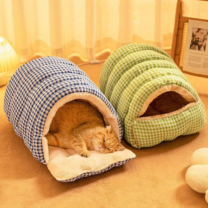 Two checkered wool cat cave, one blue and one green, with a cat inside on a beige carpet.
