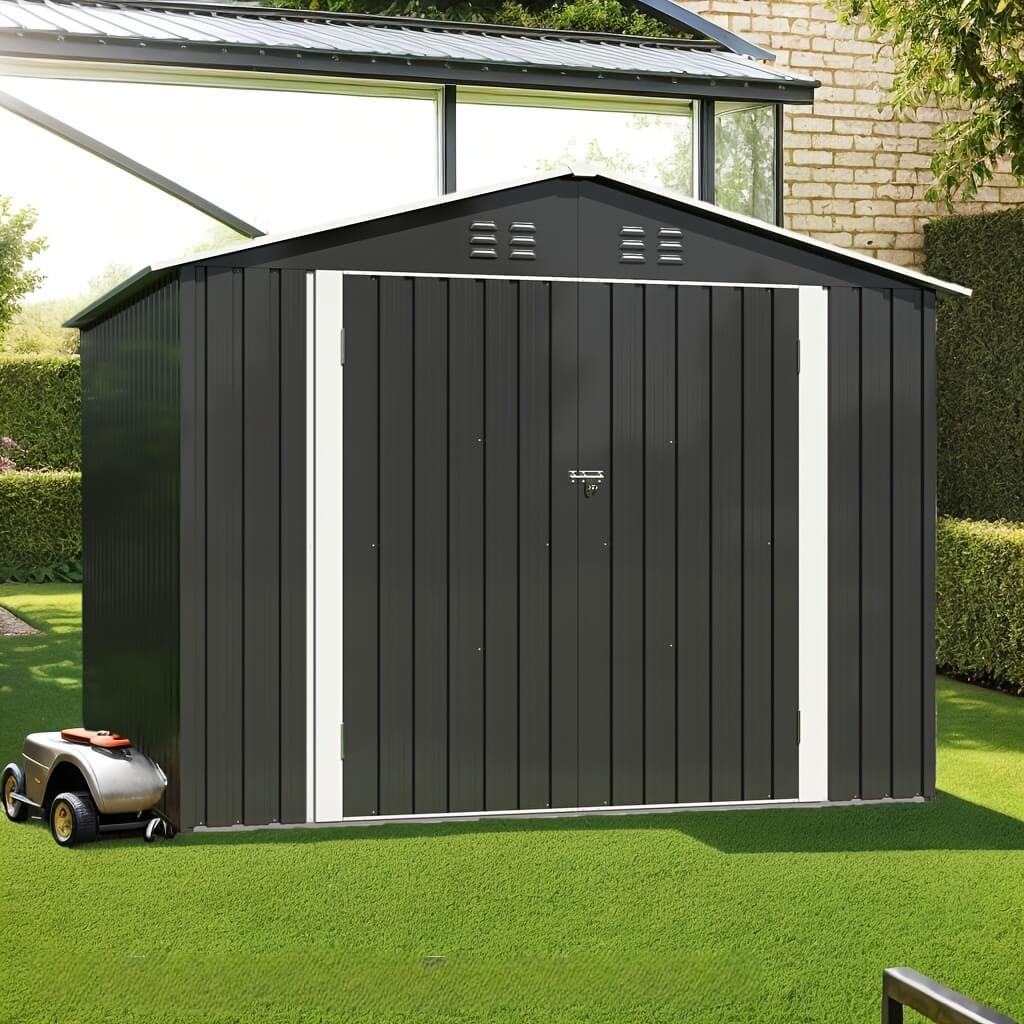 Black metal storage shed with white trim on a grassy area, surrounded by greenery.