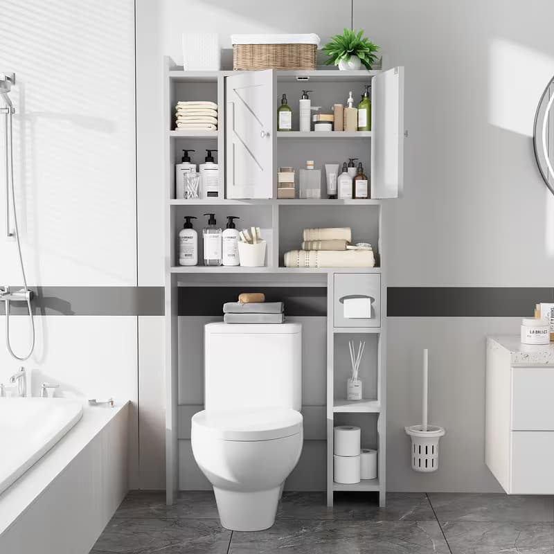 A tall, light gray bathroom storage cabinet with multiple shelves and doors, shown installed above a white toilet in a modern, clean bathroom setting.