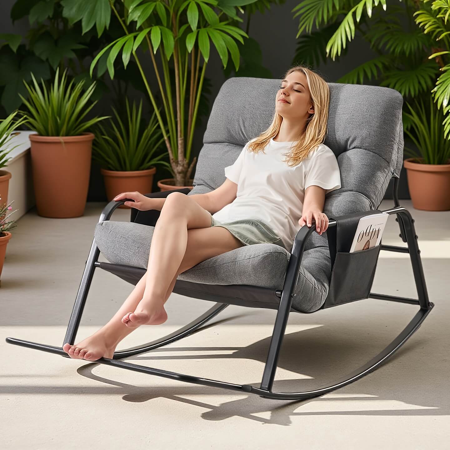 A woman relaxing on a modern rocking chair surrounded by plants.