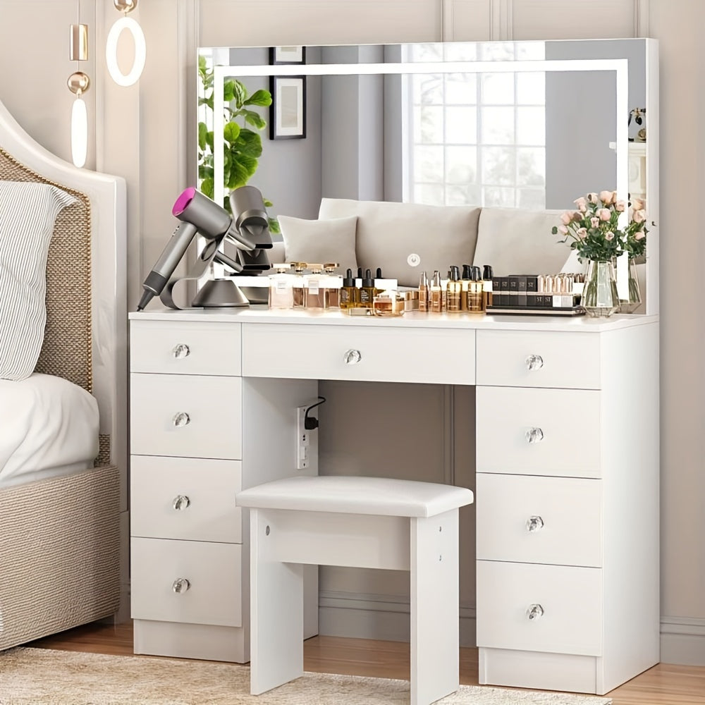 White vanity desk with mirror, chair, and various items in a bedroom setting.