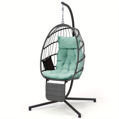Hanging egg chair with green cushion and stand on a white background