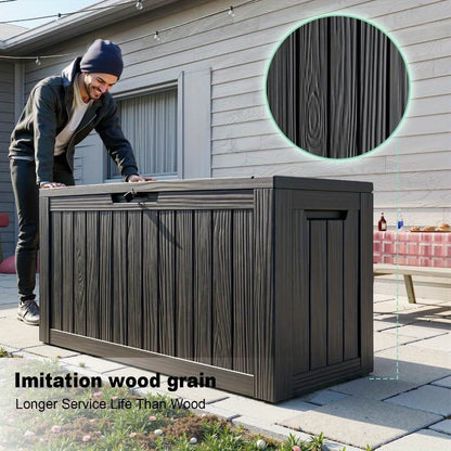 Person interacting with a large outdoor storage box with imitation wood grain finish.
