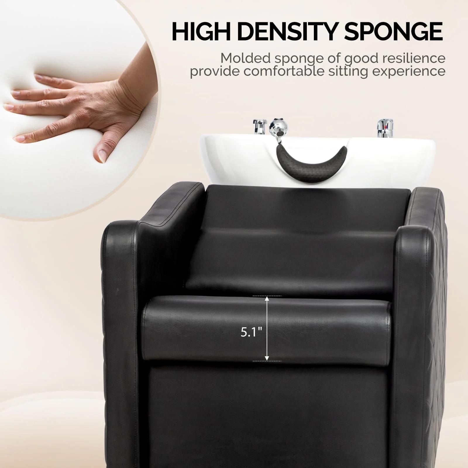 Black salon chair with a white basin and high-density sponge cushion, showing a hand for scale.