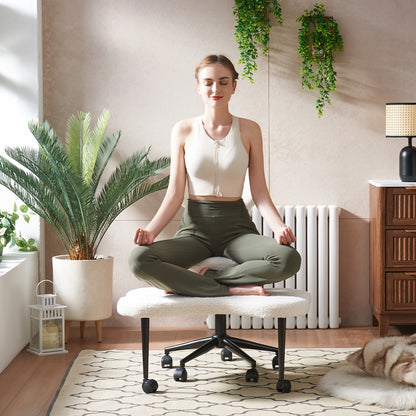Woman meditating on a stool in a home setting with plants and furniture.