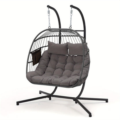 Hanging egg chair with gray cushions on a white background