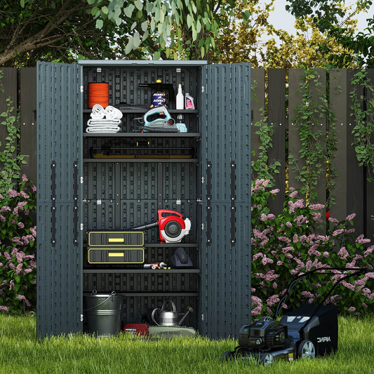 Resin outdoor storage shed with gardening tools and equipment in a garden setting