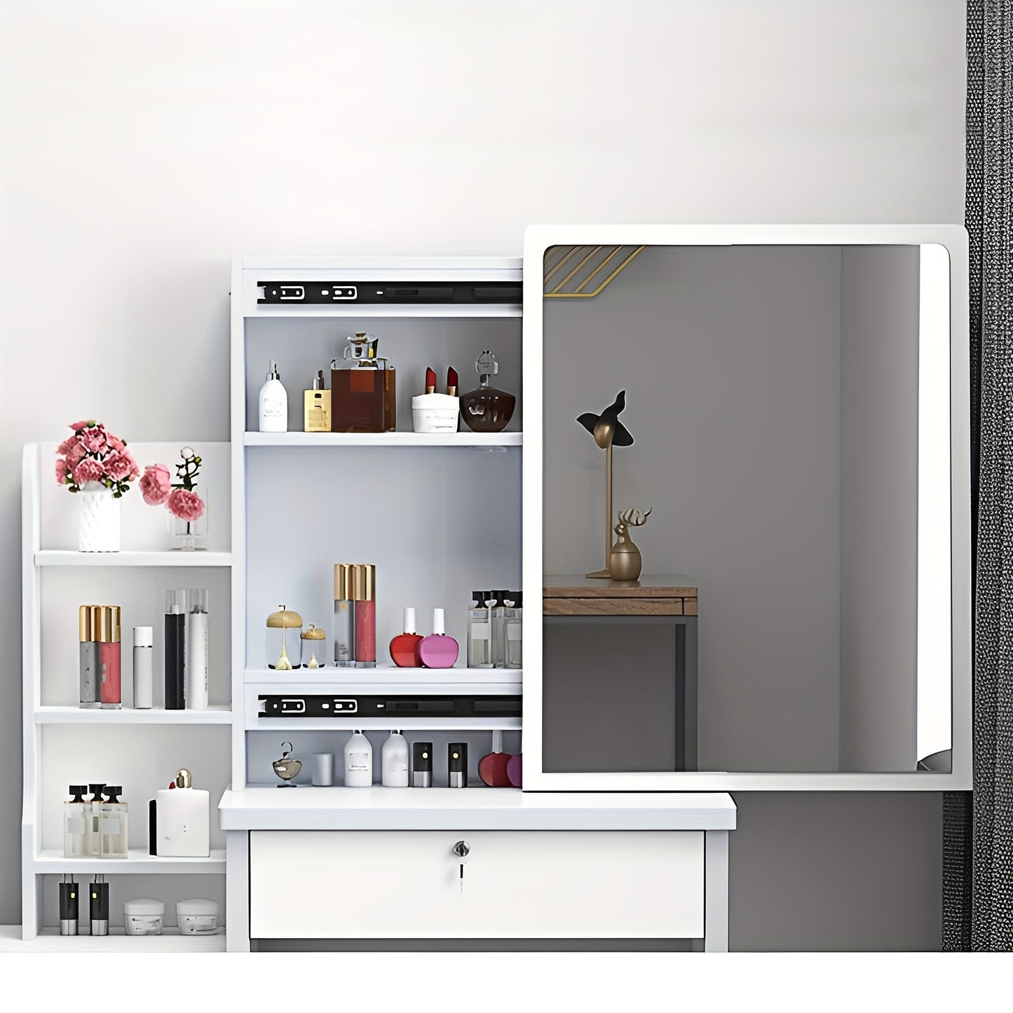 White vanity unit with mirror and cosmetic products against a gray wall.