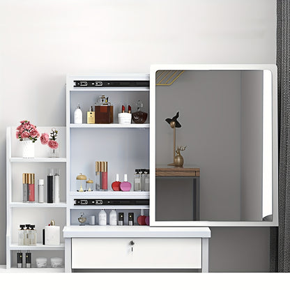 White vanity unit with mirror and cosmetic products against a gray wall.