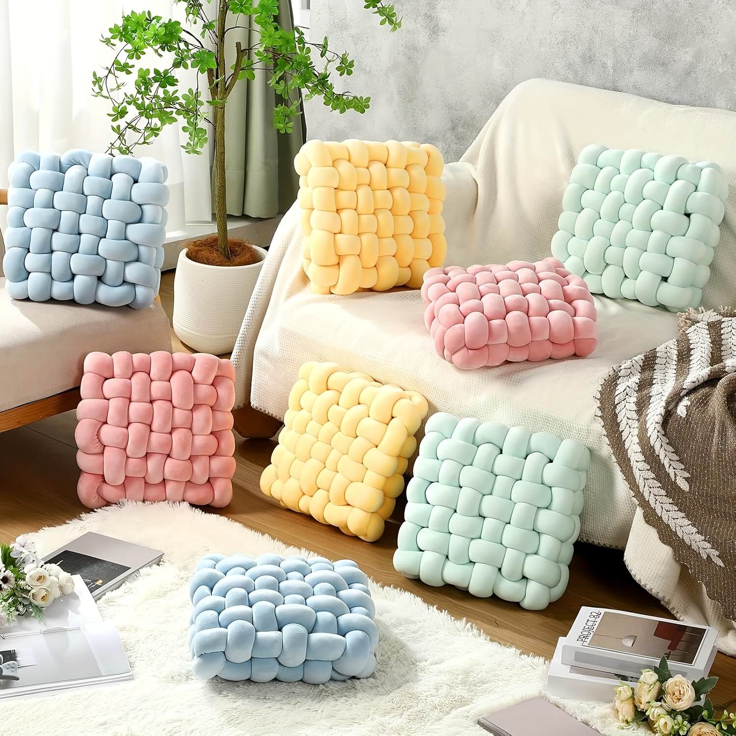 Colorful textured knot pillows on a sofa in a living room setting.