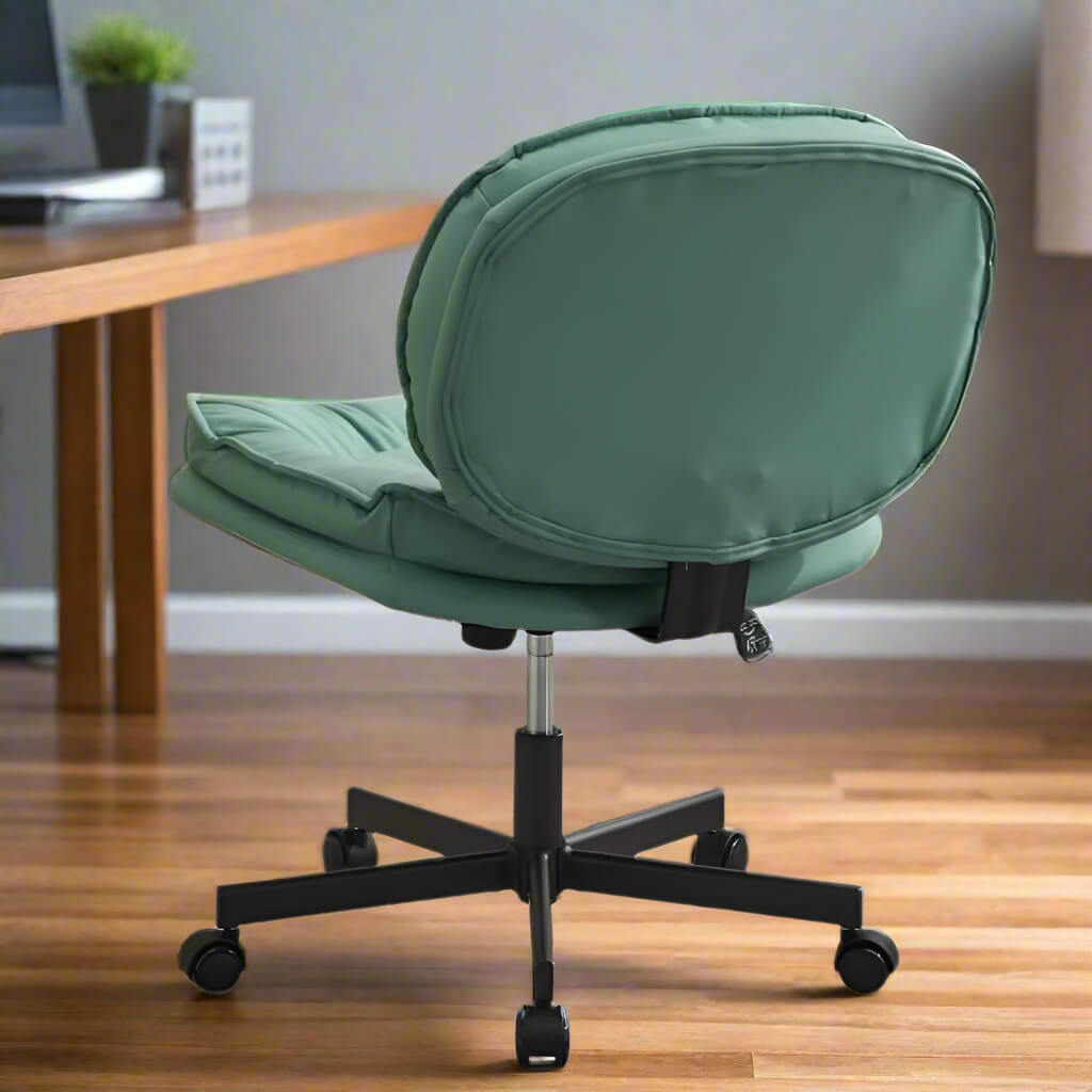 The back view of a Green armless vintage office chair used in a professional home office 